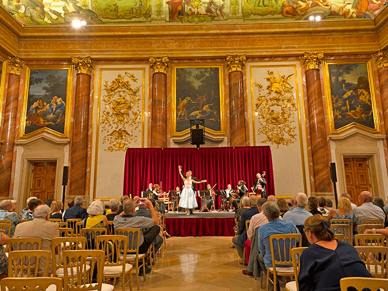 Guests watching a classical concert and performance at Palais Lichtenstein, Vienna