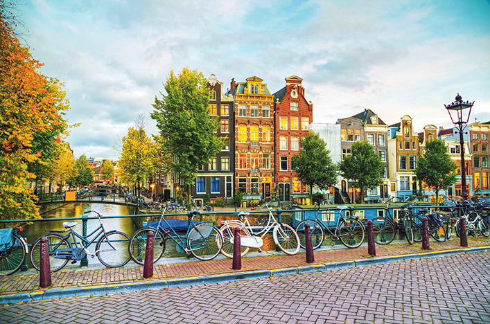 Bikes by the river in Amsterdam