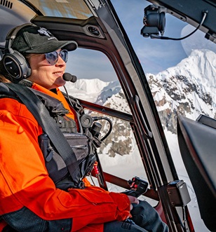 Scenic Eclipse Helicopter pilot flying over Recess Cove, Charlotte Bay, Antarctic Peninsula