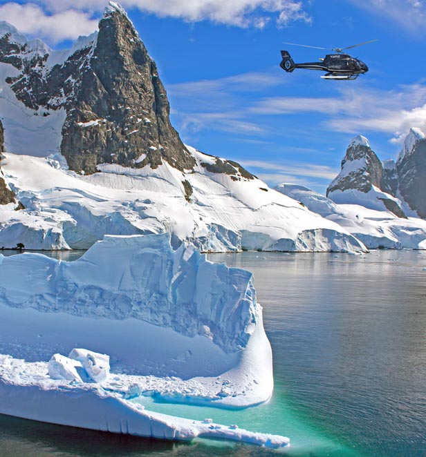 Scenic Eclipse Helicopter flying in Antarctica