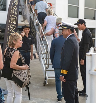 Crew welcoming guests on board Scenic space ships