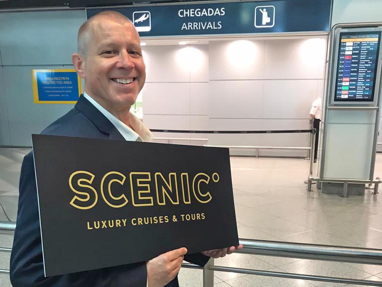 Scenic agent waiting to pickup guests at the airport