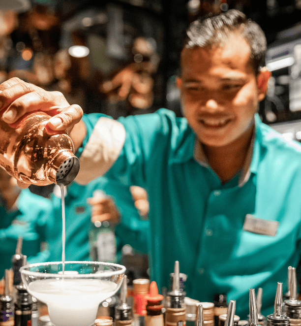 Scenic staff making drinks for guests