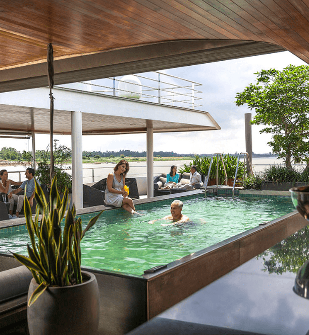 Couple enjoying the pool on Scenic Spirit