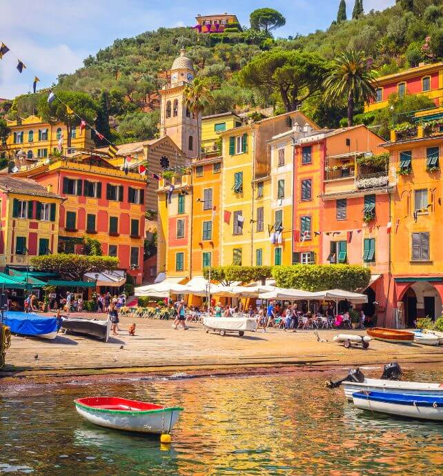 Colorful buildings and boats along the waterfront in Portofino, Italy