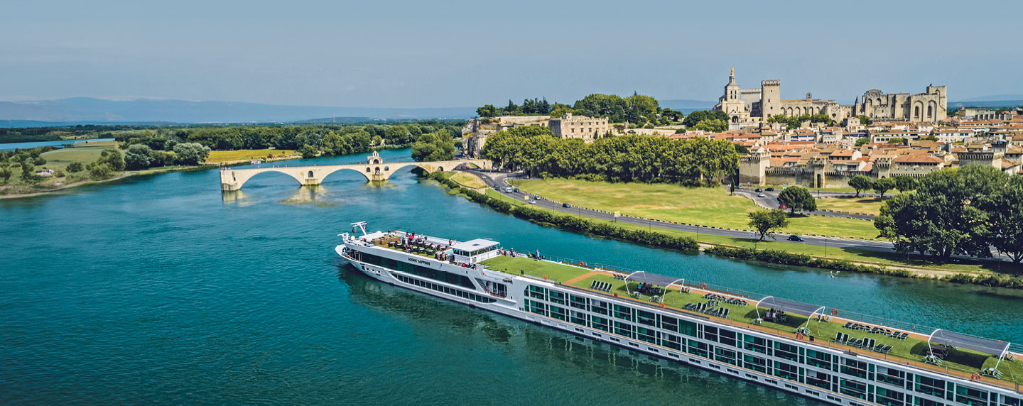 Scenic river cruise ship sailing through a European river