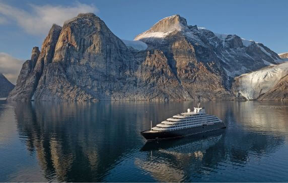 Scenic Eclipse yacht sailing through a calm Arctic fjord