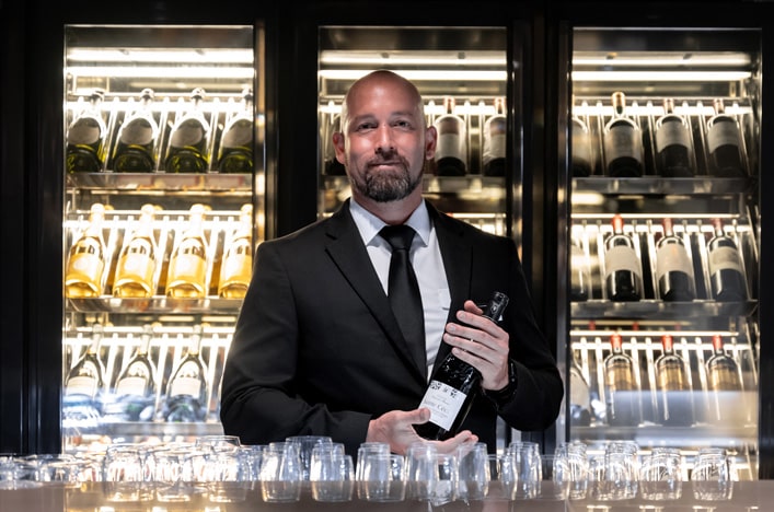 Bar staff at Champagne Bar on board Scenic cruise ship